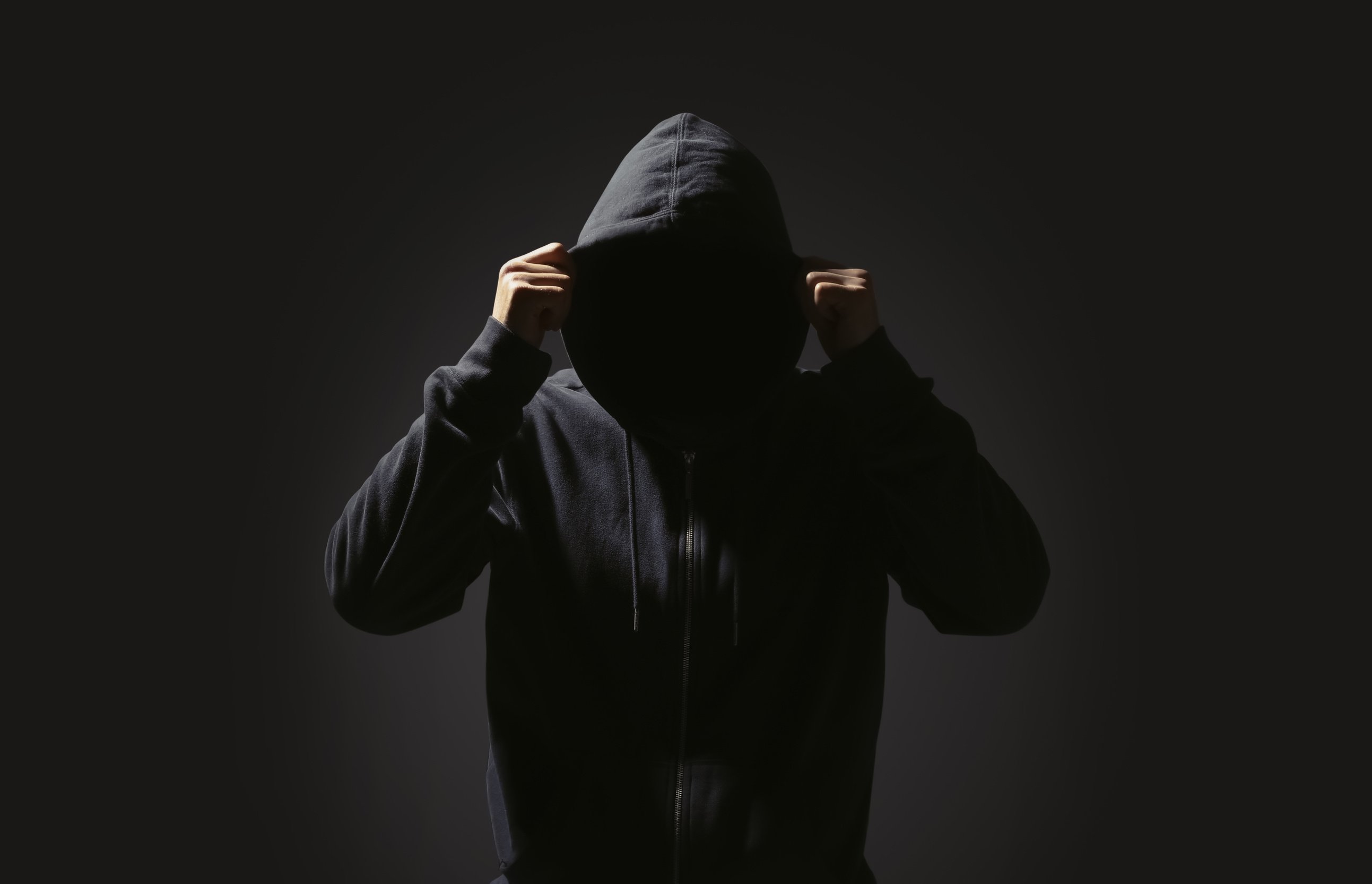 Silhouette of Anonymous Man on Black Background